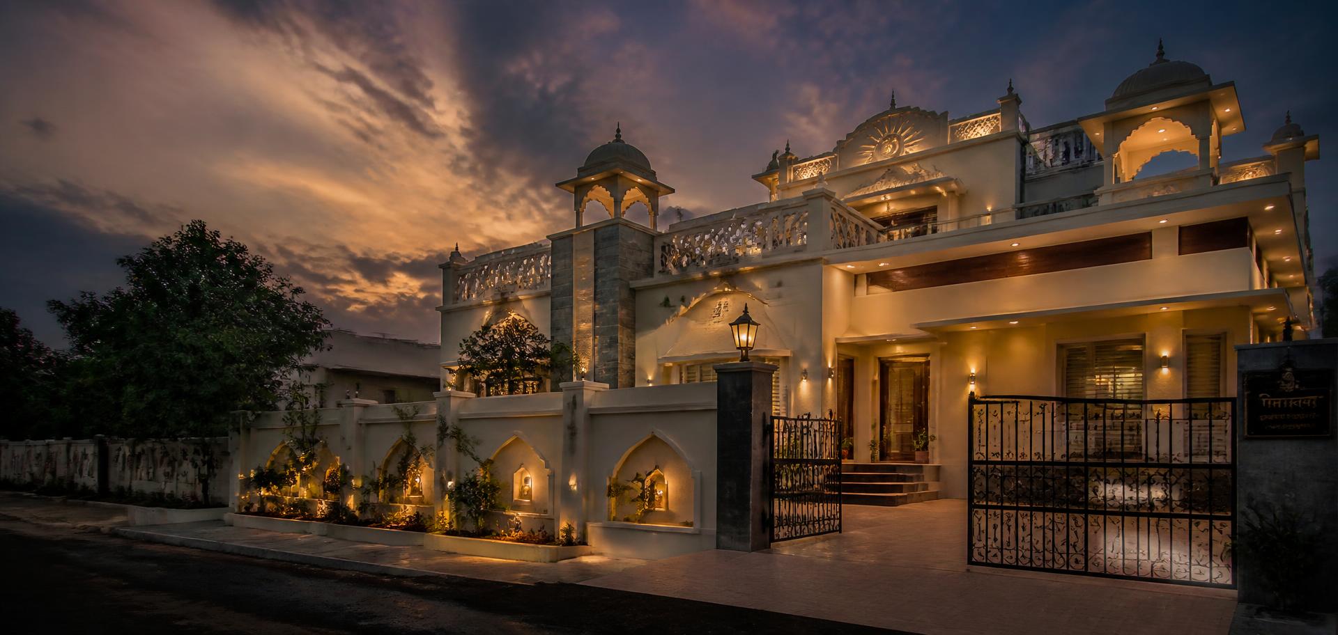 Illuminated traditional Indian home at dusk
